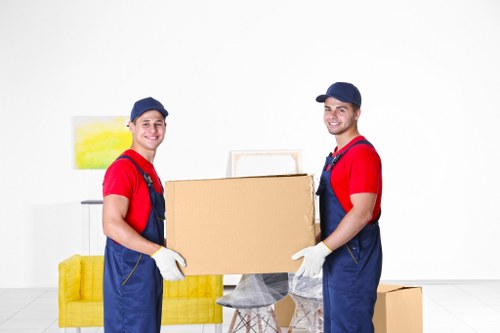 House removals planning in Harrow Weald with packed boxes and moving van