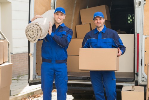 Professional movers loading furniture during house removals in Harrow Weald