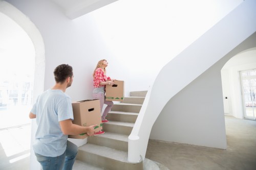 Packed moving boxes and furniture prepared for flat removals in Harrowweald