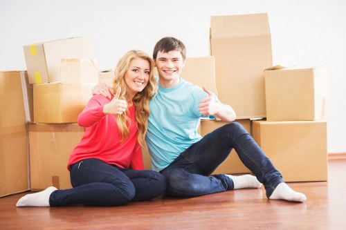 Professional moving team packing boxes for storage