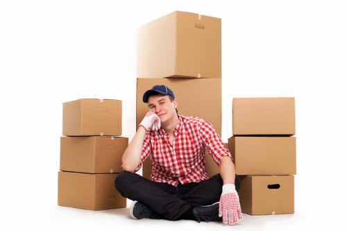 Removal professionals loading furniture for a Harrowweald flat move